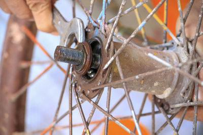 Close-up of man working on metal