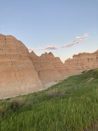 Scenic view of rocks on field against sky