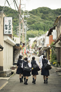 People on road in city