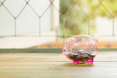 Close-up of piggy bank on table