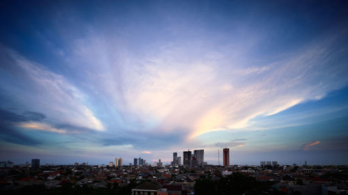 Panoramic view of buildings against sky during sunset