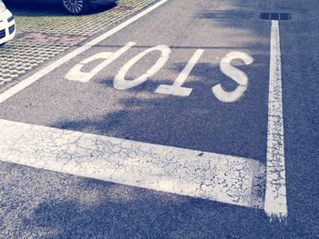 High angle view of road sign on street