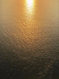 High angle view of sea at sunset