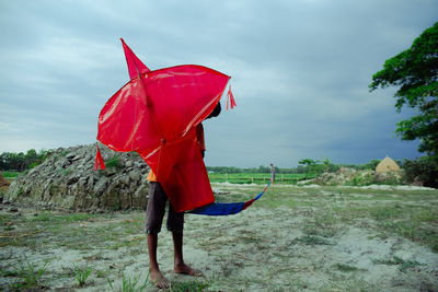 A boy with his big red kite