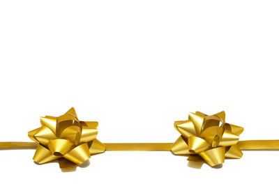 Close-up of christmas decorations against white background