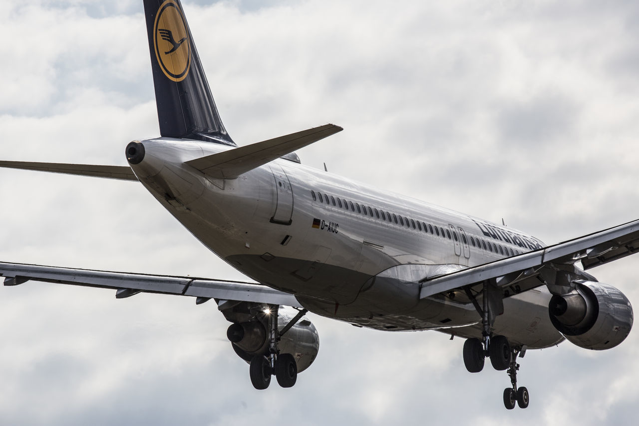 LOW ANGLE VIEW OF AIRPLANE FLYING IN SKY