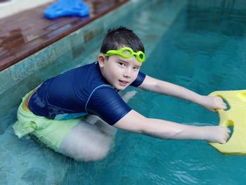 Portrait of boy in swimming pool