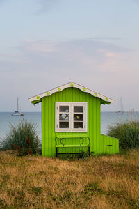 House on beach against sky