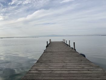 Pier over sea against sky