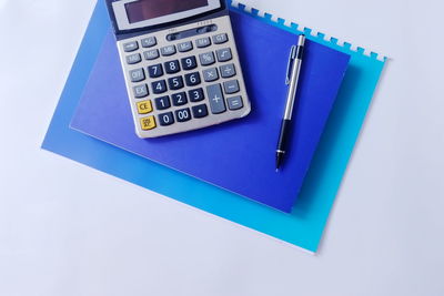 High angle view of pen on table against white background