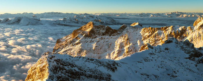 Scenic view of snowcapped mountains against sky