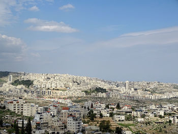 Aerial view of cityscape against sky