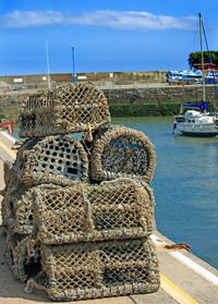 Stacked old lobster trap at harbor