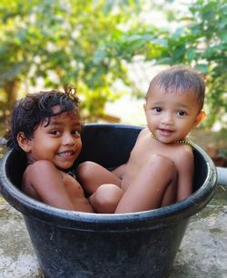 Two small child's are bathtub