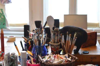 Close-up of paintbrushes on table