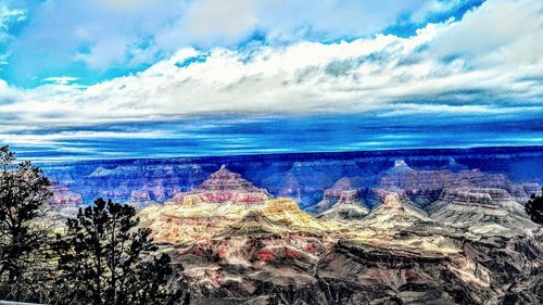 Scenic view of landscape against cloudy sky