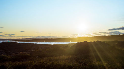 Scenic view of landscape against sky during sunset