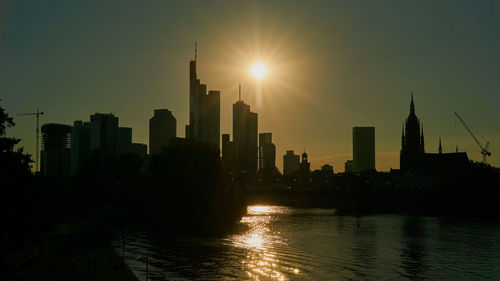 Skyscrapers lit up at sunset