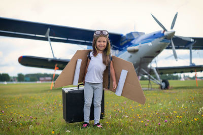 Portrait of young woman sitting on airplane