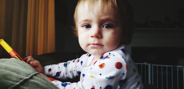 Portrait of cute baby girl at home