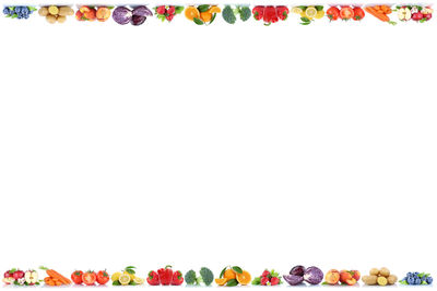 Multi colored umbrellas against white background