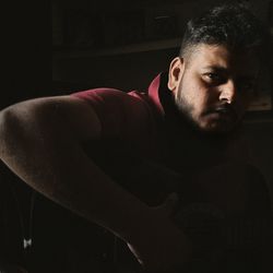 Portrait of young man looking away