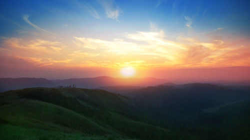 Scenic view of landscape against sky during sunset