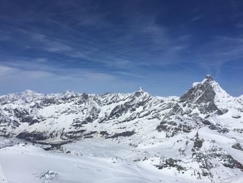 Idyllic shot of snowcapped mountains against sky