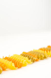 Close-up of rice against white background