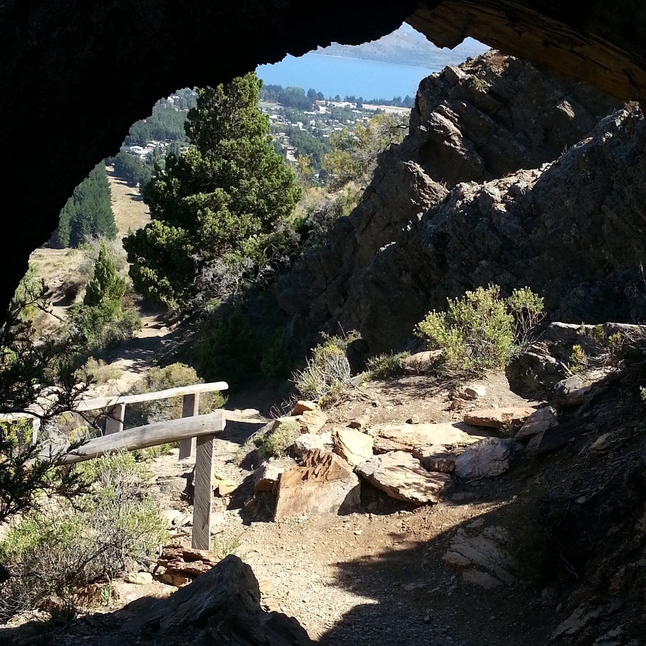 tranquility, rock - object, built structure, mountain, tree, steps, sunlight, nature, tranquil scene, architecture, rock formation, scenics, beauty in nature, day, sky, shadow, railing, no people, plant, clear sky