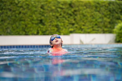 Portrait of man swimming in pool