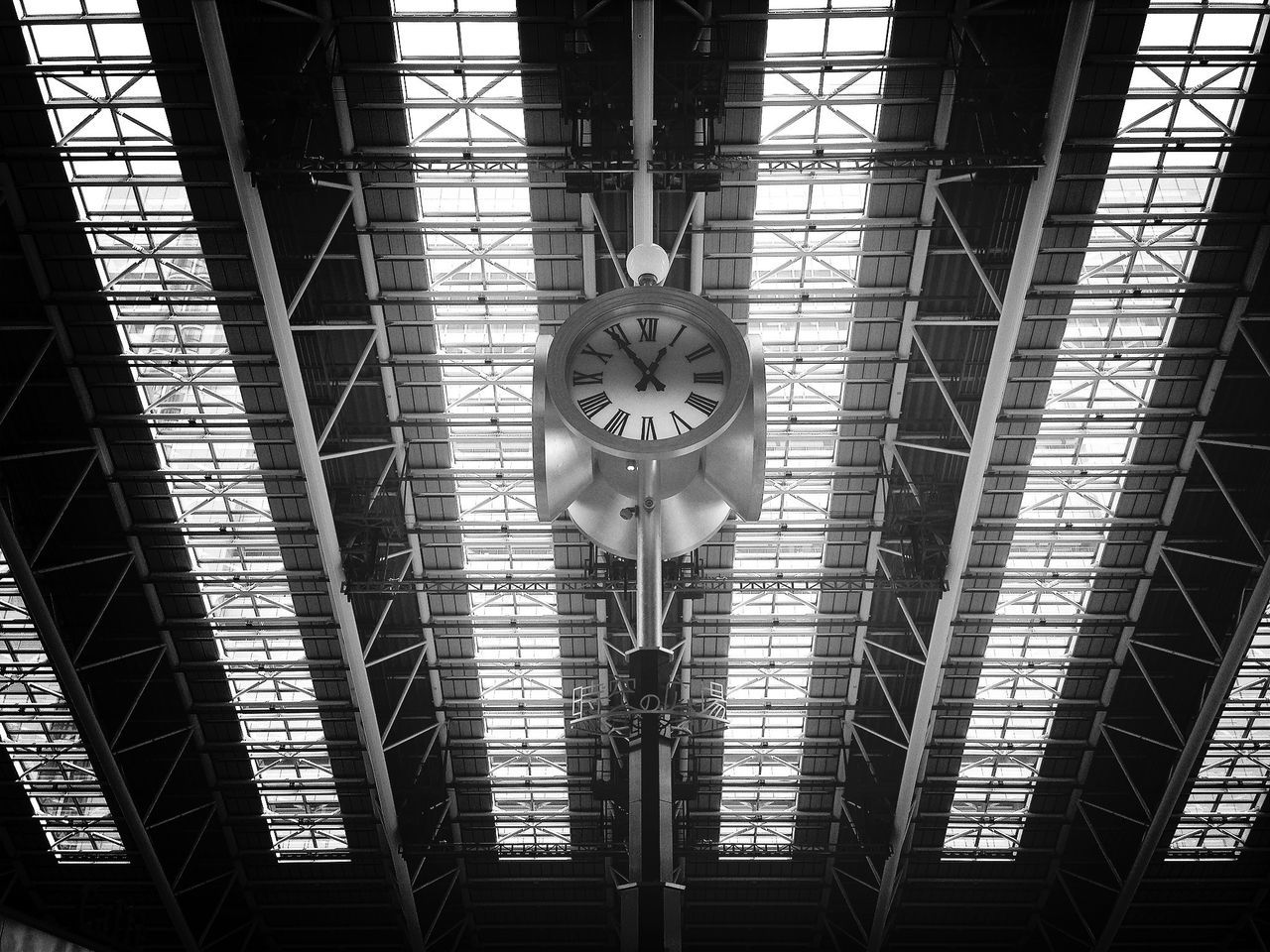 architecture, indoors, low angle view, built structure, ceiling, railroad station, glass - material, rail transportation, pattern, metal, no people, clock, public transportation, window, day, full frame, time, backgrounds, architectural feature, building exterior