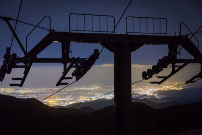 Low angle view of silhouette mountain against dramatic sky