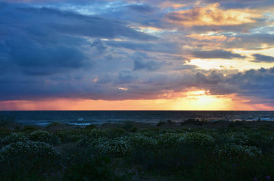 Scenic view of sea against sky at sunset