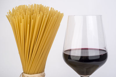 Close-up of beer glass against white background