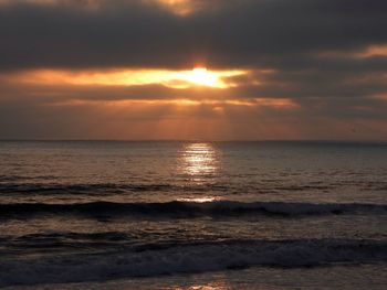 Scenic view of sea against sky during sunset