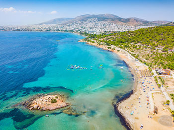 High angle view of sea and bay against sky