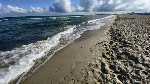 Scenic view of beach against sky