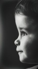 Close-up portrait of serious young man looking away