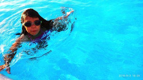 Woman swimming in pool