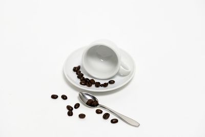 High angle view of coffee served on white background