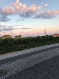 Road against sky at sunset