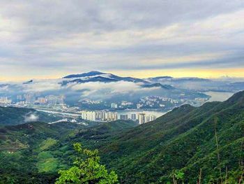 Aerial view of cityscape against sky at night