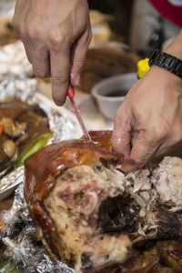 Close-up of man preparing food