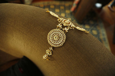 High angle view of necklace on sofa