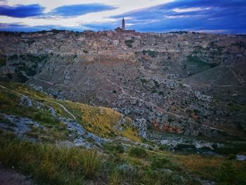 Scenic view of landscape against cloudy sky