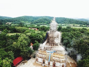 Panoramic view of temple and building against sky