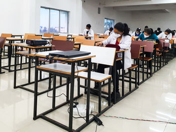 People sitting on chair at table