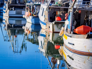 Boats moored at harbor