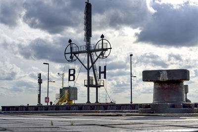 Low angle view of crane against sky